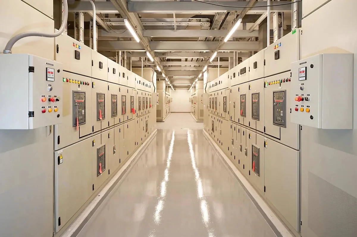 Aisle of medium and low voltage switchgear in a data center electrical room